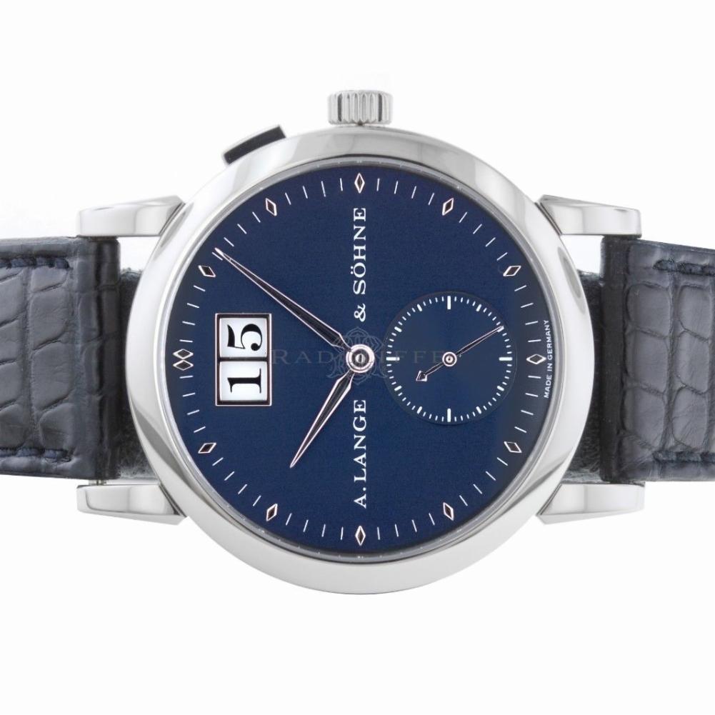 A. Lange & Sohne Saxonia Reference #:105.027. A Lange & Sohne 105.027 Saxonia Big Date Dark Blue 18kt White Gold Near Mint. Verified and Certified by WatchFacts. 1 year warranty offered by WatchFacts.
