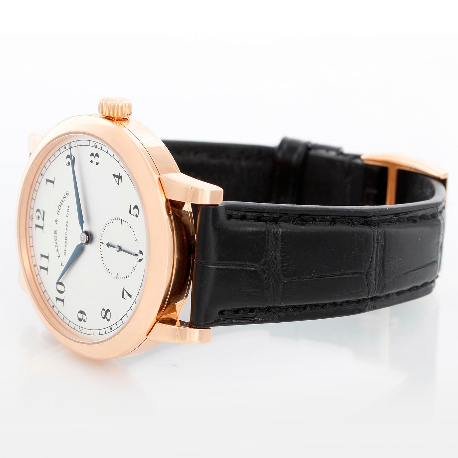 A. Lange & Sohne 1815 Men's 18k Rose Gold Watch - Manual winding. 18k rose gold case (40mm diameter). Silver dial with Arabic numerals; sub-seconds dial. Strap band with 18k rose gold tang clasp. Pre-owned with A Lange & Sohne box. 
