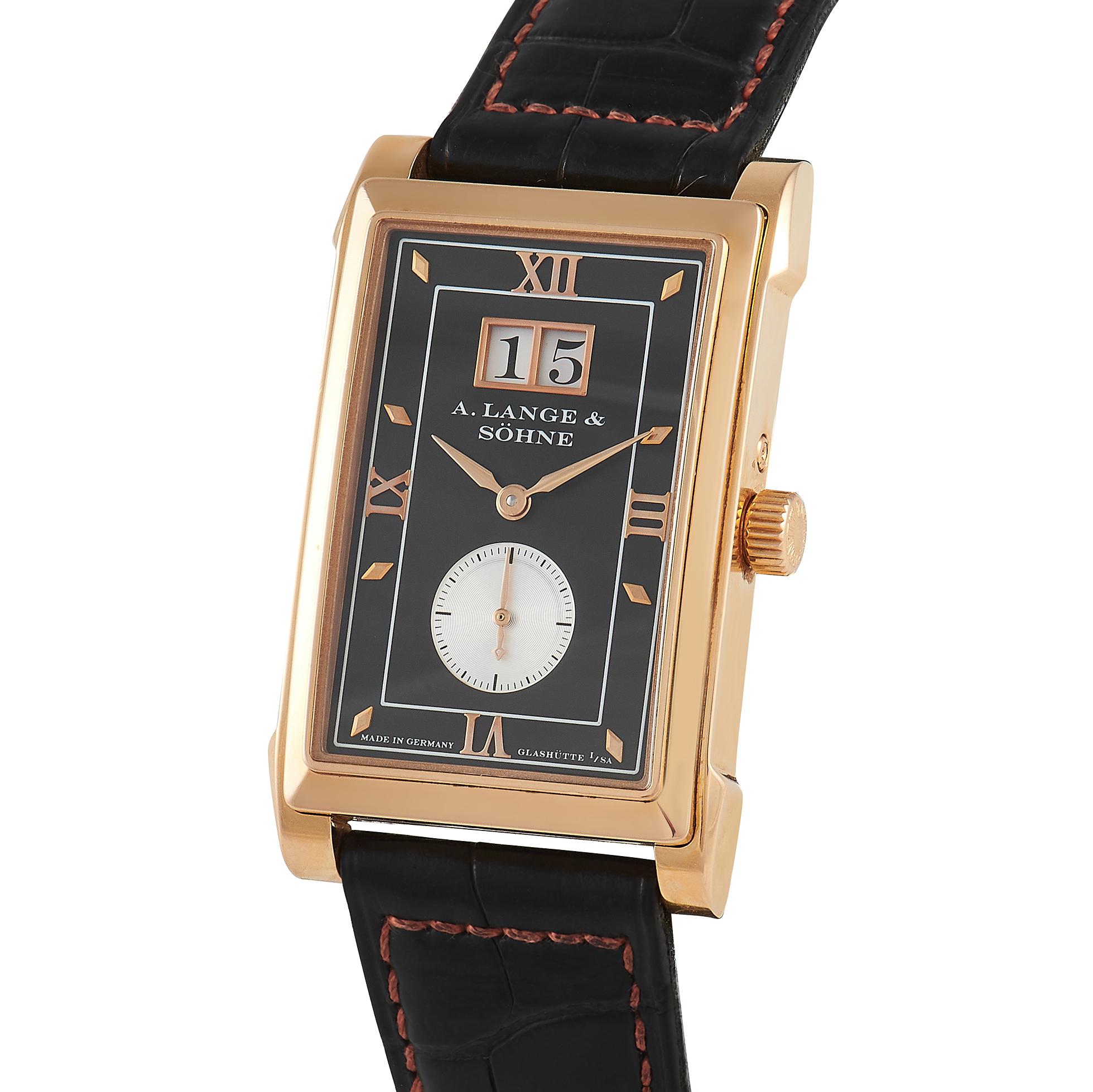 Introduced in 1997 is this rectangular timepiece with an elaborate case and a charming dial. The 36.3 mm x 25.5 mm three-body case is fashioned from 18K rose gold with a brushed case band, polished lugs, and a stepped bezel. Everything on the black