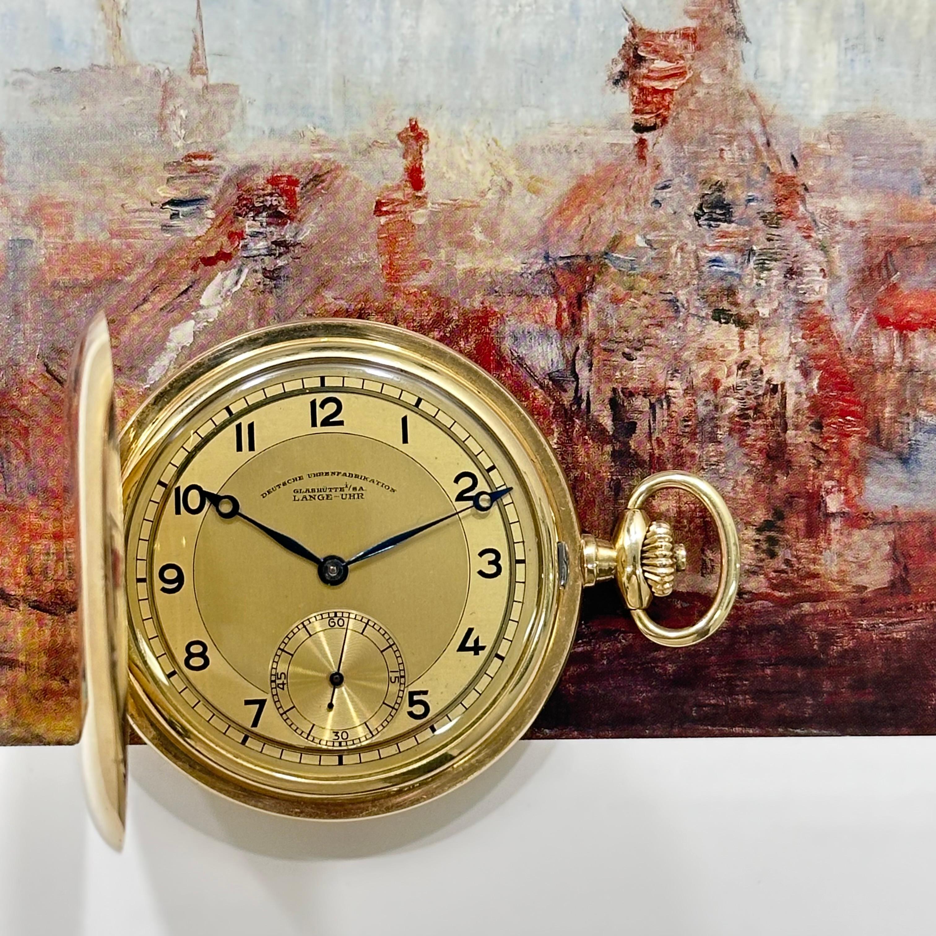 This beautiful pristine 14ct Yellow Gold Full Hunter pocket watch with a champagne two tone satin finished dial signed D U F with Arabic numerals outer minute track and original Breguet style moon hands with subsidiary seconds dial.
 
The case is in