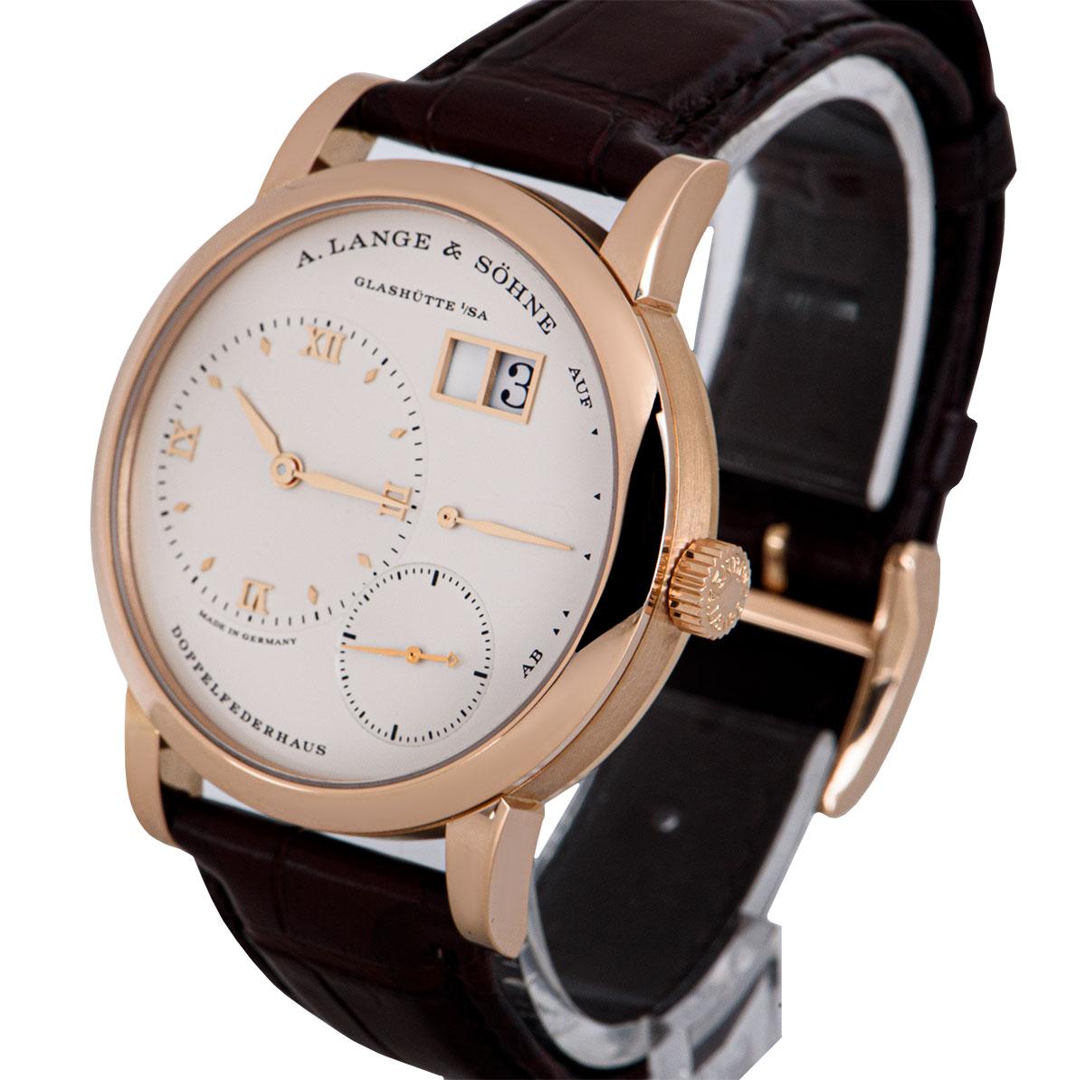 A 38.5 mm 18k Rose Gold Lange 1 Gents Wristwatch, argente silver dial - date at 1 0'clock, power reserve indicator at 3 0'clock, small seconds at 5 0'clock, argente silver off-centred dial at 9 0'clock with applied hour markers and applied roman