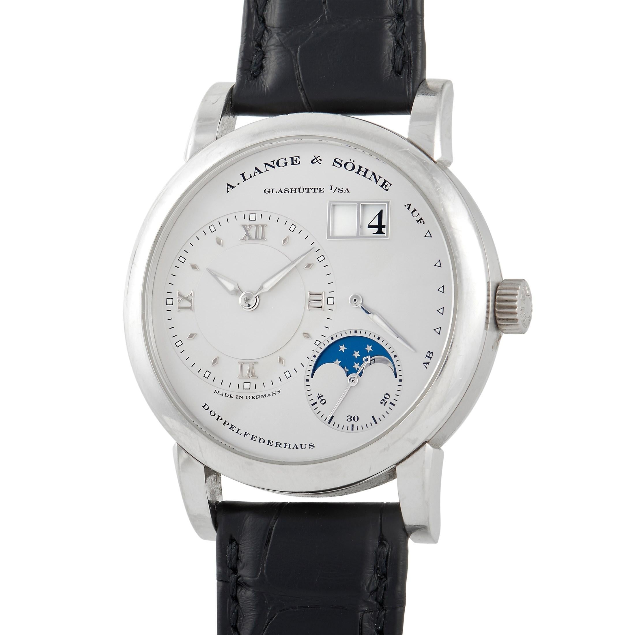 A handsome, accurate, and reliable timepiece from a reputable German manufacturer of luxury watches. The A. Lange & Söhne Lange 1 Moon Phase Platinum Watch 109.025 features a polished platinum case with the edges in fine satin finish. The dial is