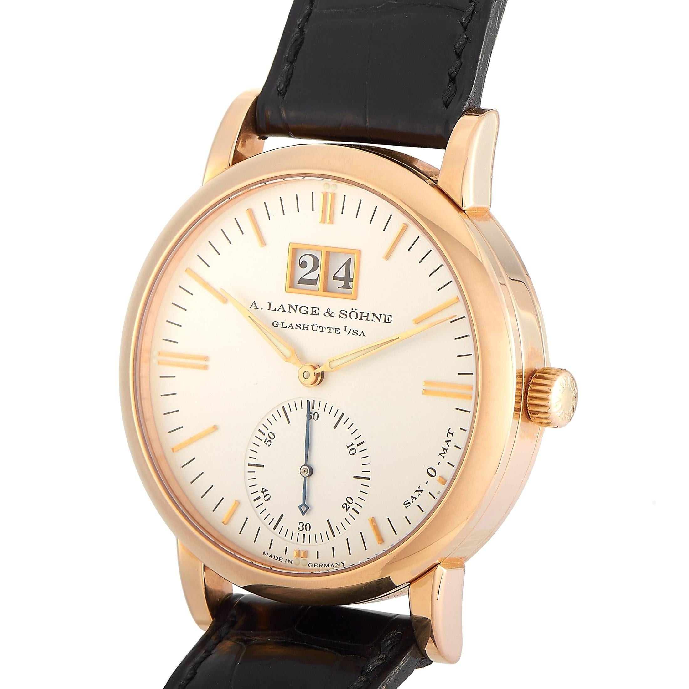 The A. Lange & Sohne Langematik Watch, reference number 308.032, is a sleek, simple, and sophisticated luxury piece. 

This watch’s 37mm case is crafted from 18K rose gold and houses an attractive silvery white dial. Along with the minutes and