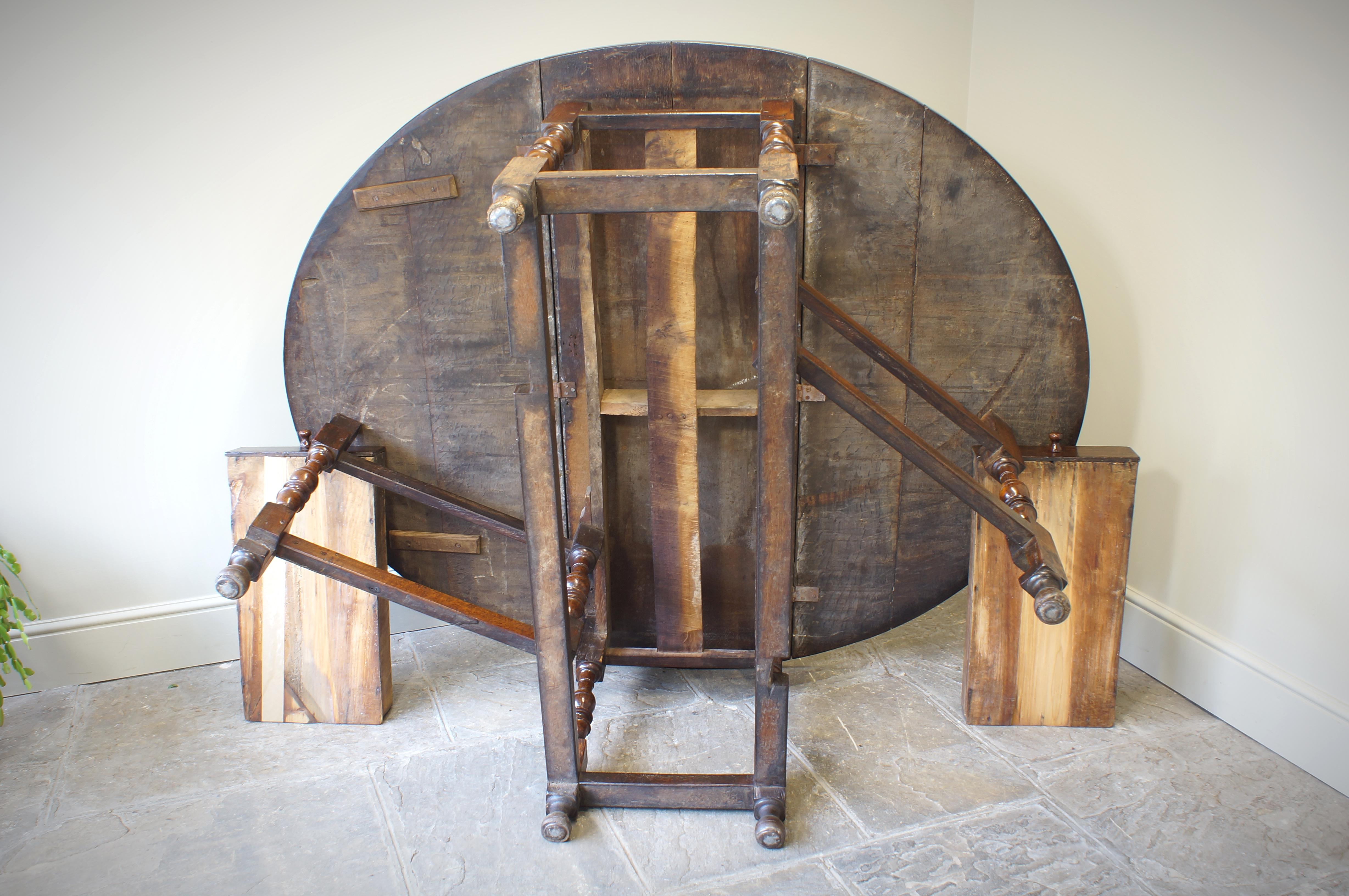 A large excellent  William and Mary oak gate leg table. Having a good thick top with two boards per leaf and a useful drawer at each end. Well turned baluster legs joined by moulded stretchers and retaining the original toes. 
This large and better