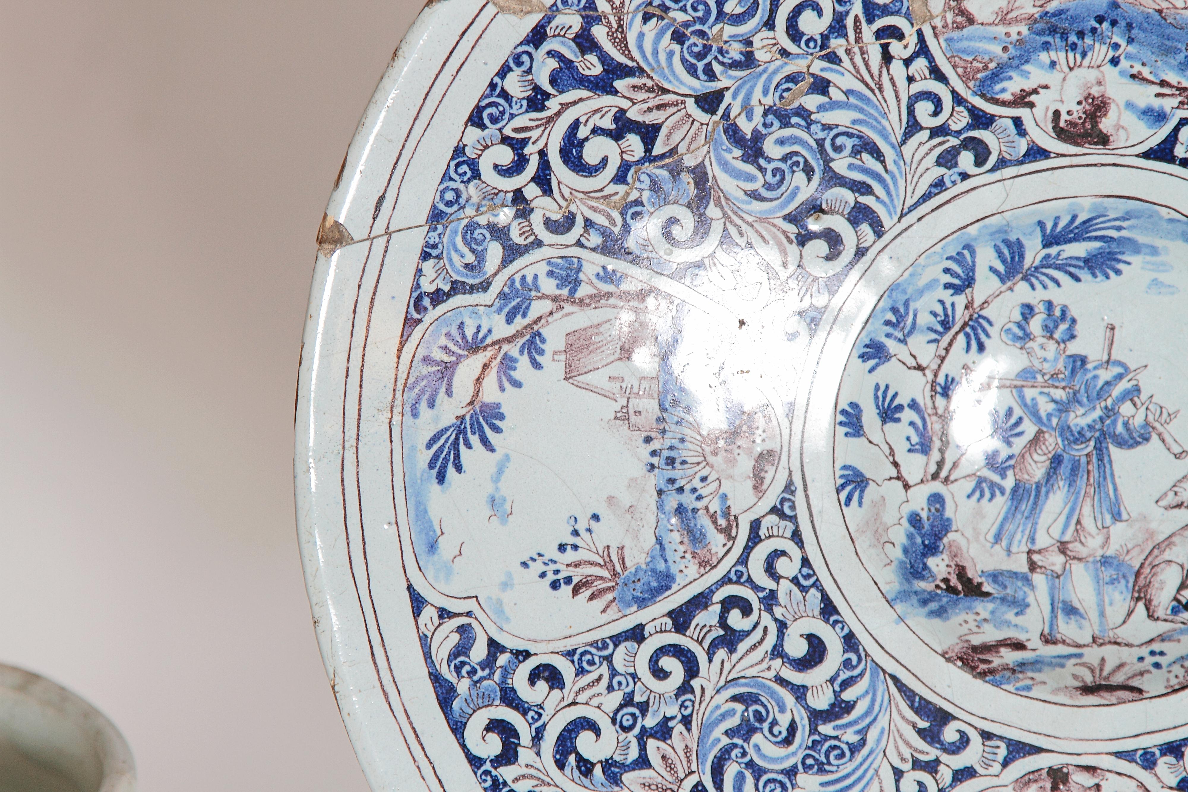 Hand-Painted A Large 18th Century Delft Faience Charger with Floral Cartouches For Sale