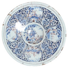 A Large 18th Century Delft Faience Charger with Floral Cartouches