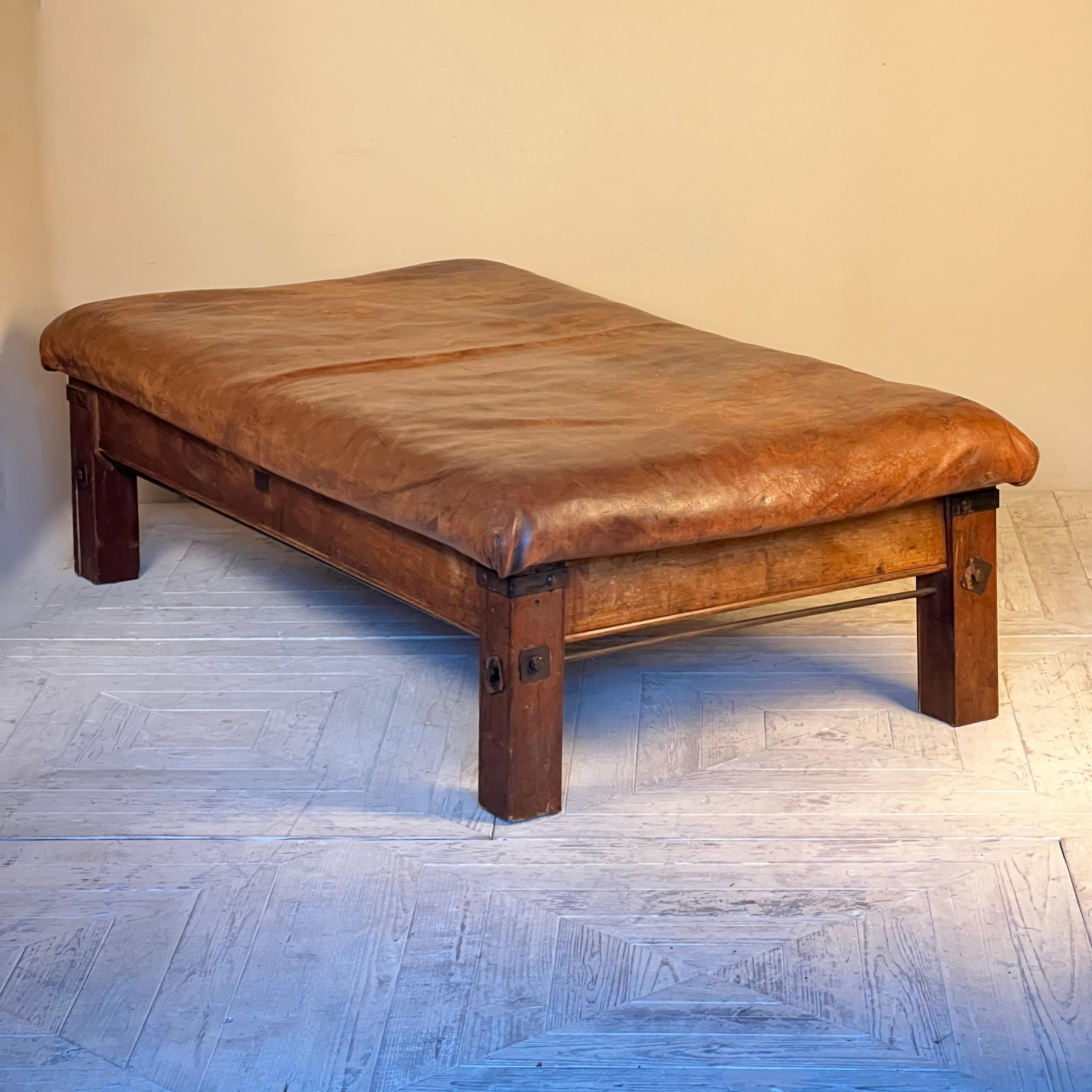 Presenting a striking 1930/40s Leather Pommel Table, a unique blend of rustic elegance and industrial strength. This one-of-a-kind piece features a beautifully worn, thick leather top resting on a sturdy square legged oak frame, offering both style
