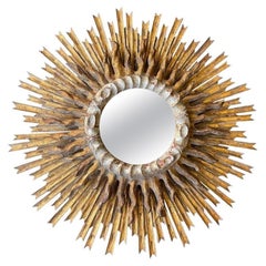 A large 1940s French carved wood gilt sunburst mirror