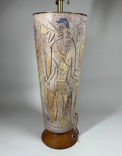 A large 1960's glazed ceramic hand-carved and decorated lamp