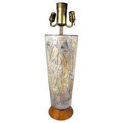 A large 1960
s glazed ceramic hand-carved and decorated lamp