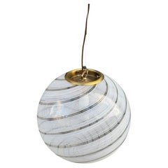 A large 1960s Venini Murano glass ball “Tessuto” swirl pendant light