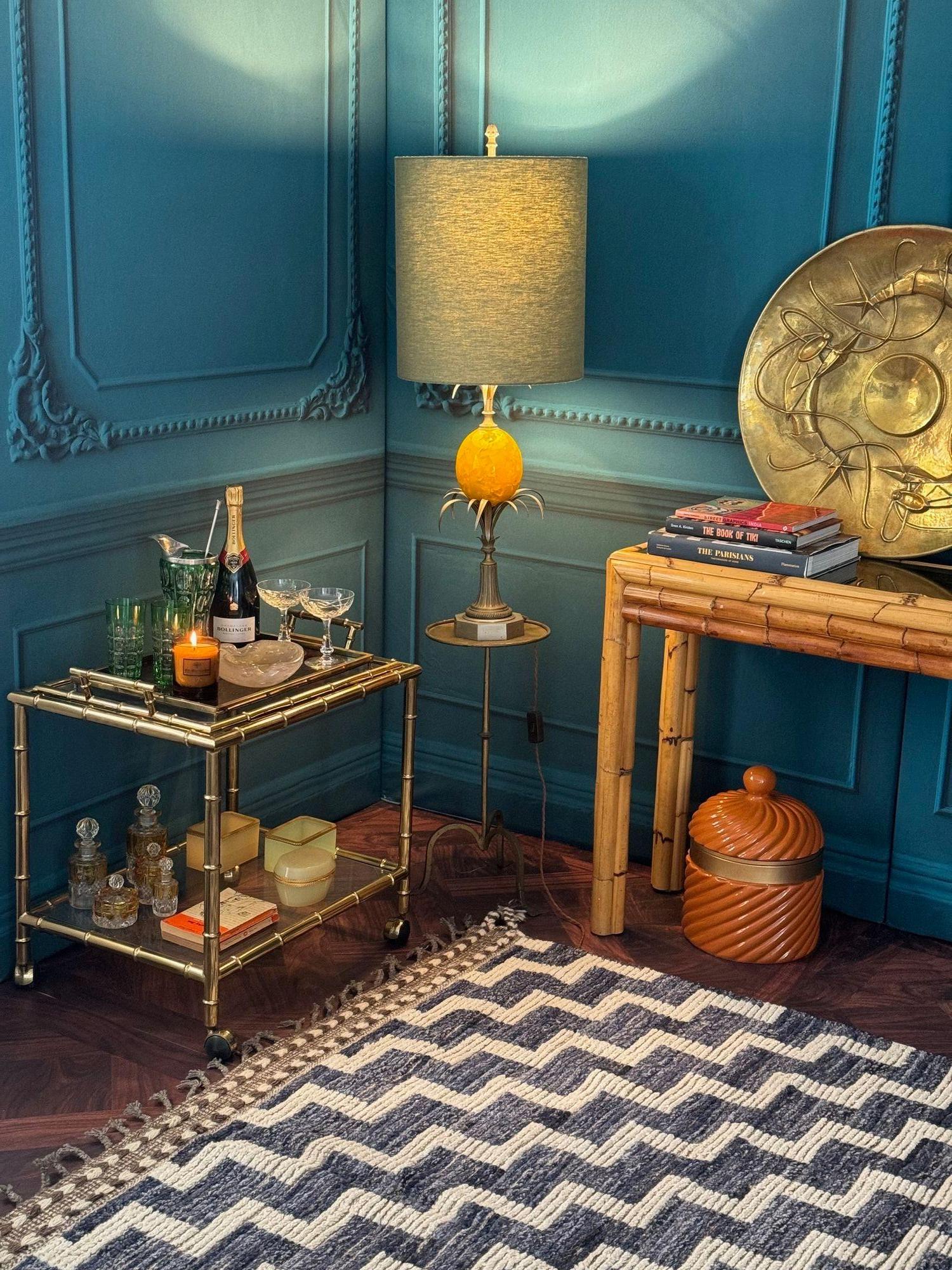 A large 1960s egg lamp attributed to Maison Charles with large yellow resin egg mounted on a gilt and nickel metal pedestal and frond base, with new bespoke green linen shade and pinecone finial top. Re wired with antique gold cord flex and PAT