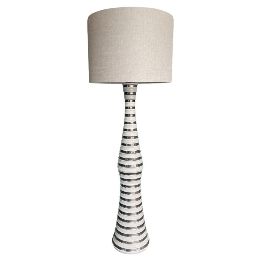 A large 1970s Italian white and silver ceramic floor lamp with linen shade For Sale