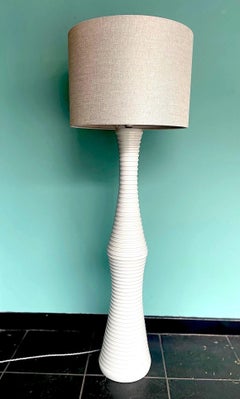 A large 1970s Italian white ribbed ceramic floor lamp with natural linen shade