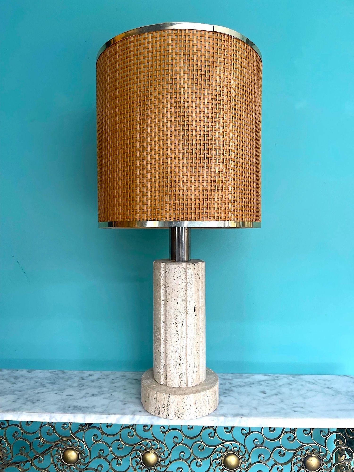 A large 1970s column shaped travertine and brass lamp by Fratelli Mannelli with orignal rattan shade with gilt metal rim
