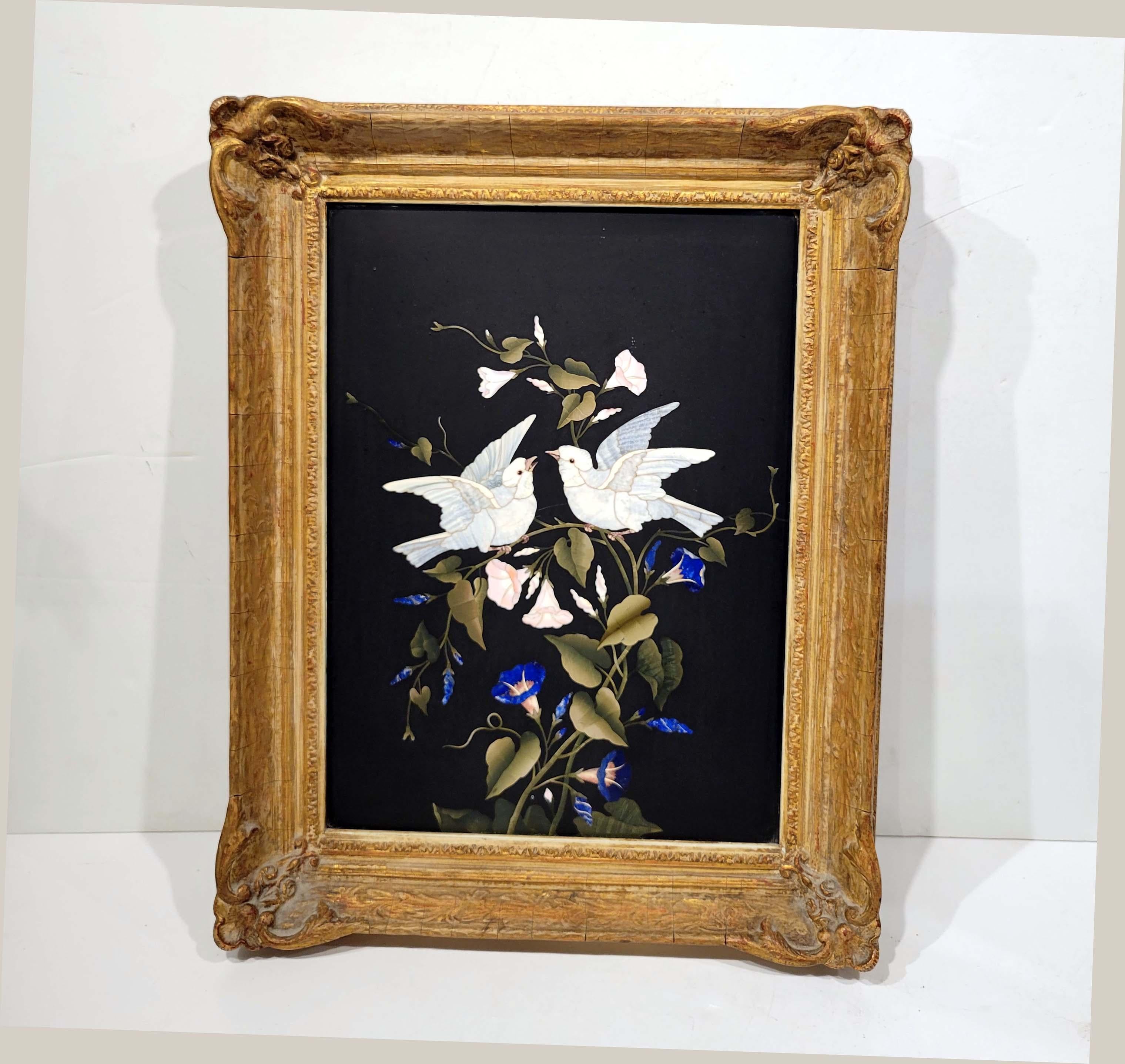 Beautifully executed inlaid marble with different specimens on black marble background. Italian Circa 2nd half of 19th century . Mounted in an antique carved frame. Nice weight to it and in great condition. Frame measures 19 x 15 inches, Plaque