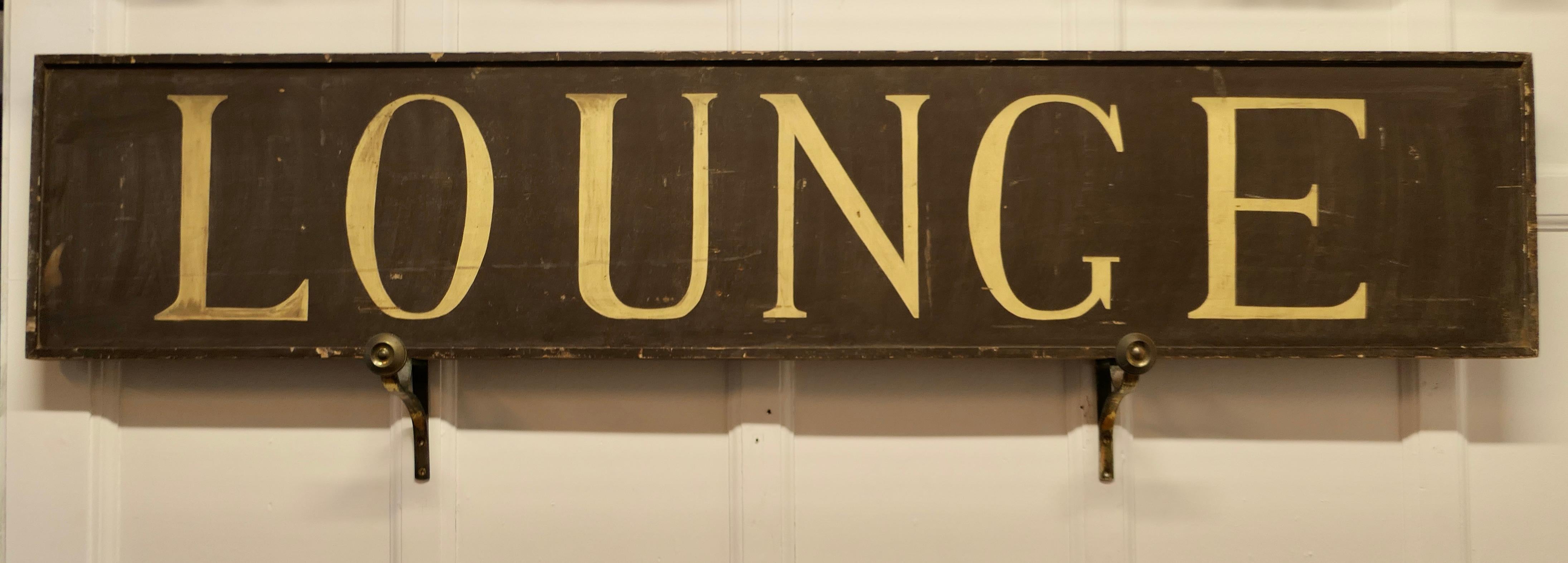 A Large 19th century Wooden Painted LOUNGE Sign 

This is an original Hotel sign it is made in wood, it is 73” long 
This is a lovely old sign it has painted lettering which has developed a crackle finish 
The sign is in good condition for its