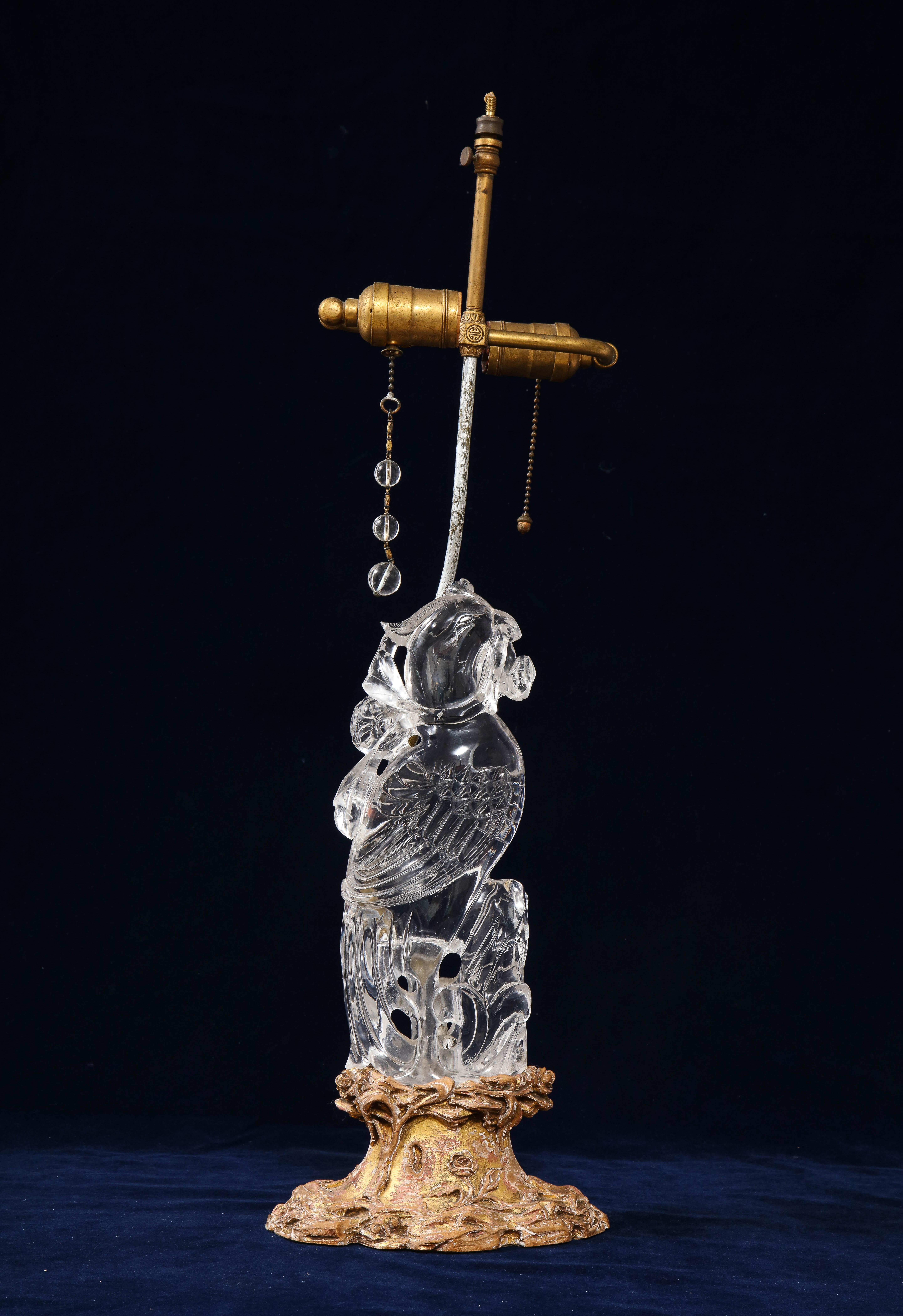 An extremely fine quality and quite large, 19th century Chinese Gilt Bronze Mounted hand-carved rock crystal phoenix lamp, attributed to Edward Farmer. The phoenix is hand-carved from a very large and super clear piece of rock crystal. There is an