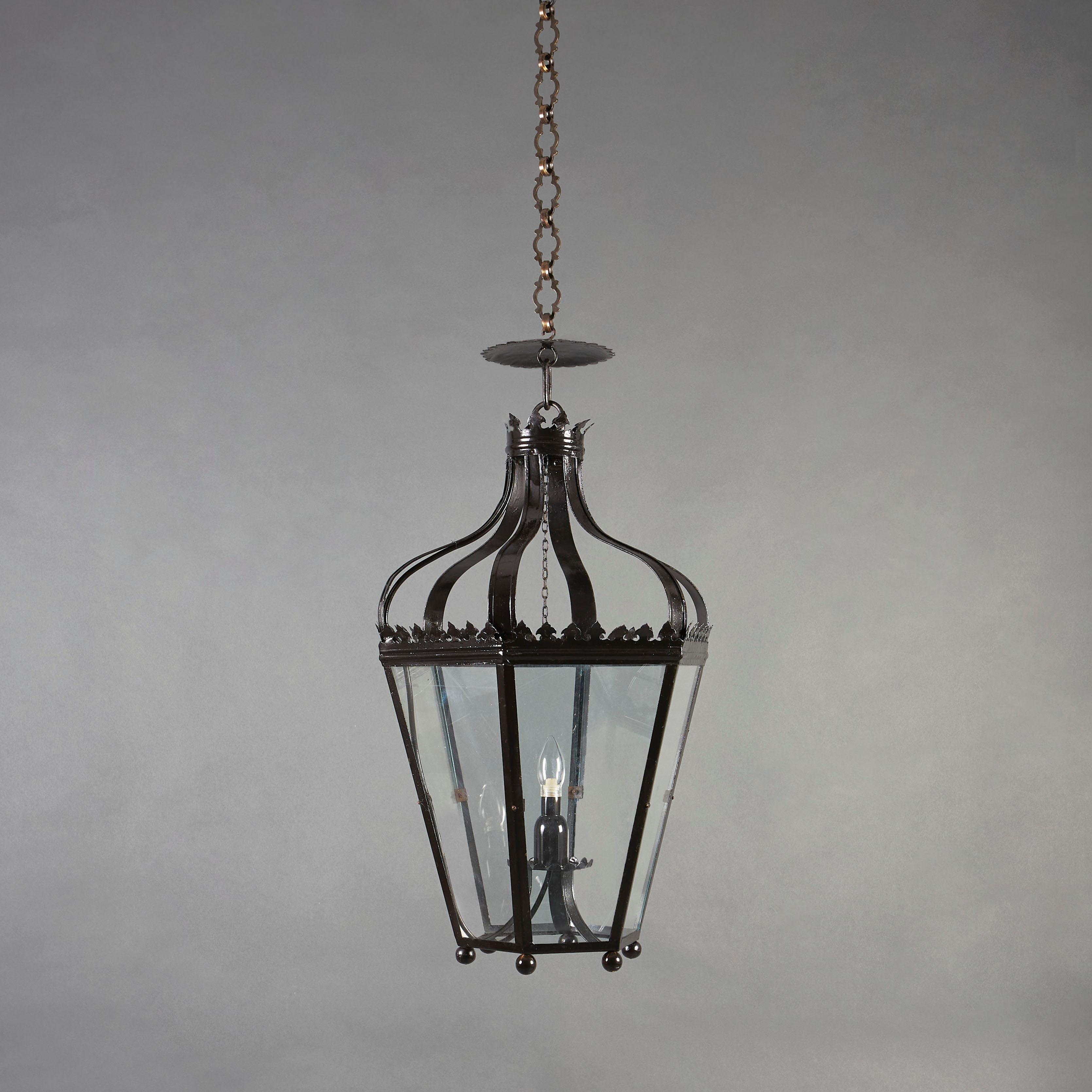 A late 19th century neo-gothic hanging lantern, with glazed sides.

Currently wired for the UK. Please enquire for rewiring services.

Chain available upon request; please contact us for details.
