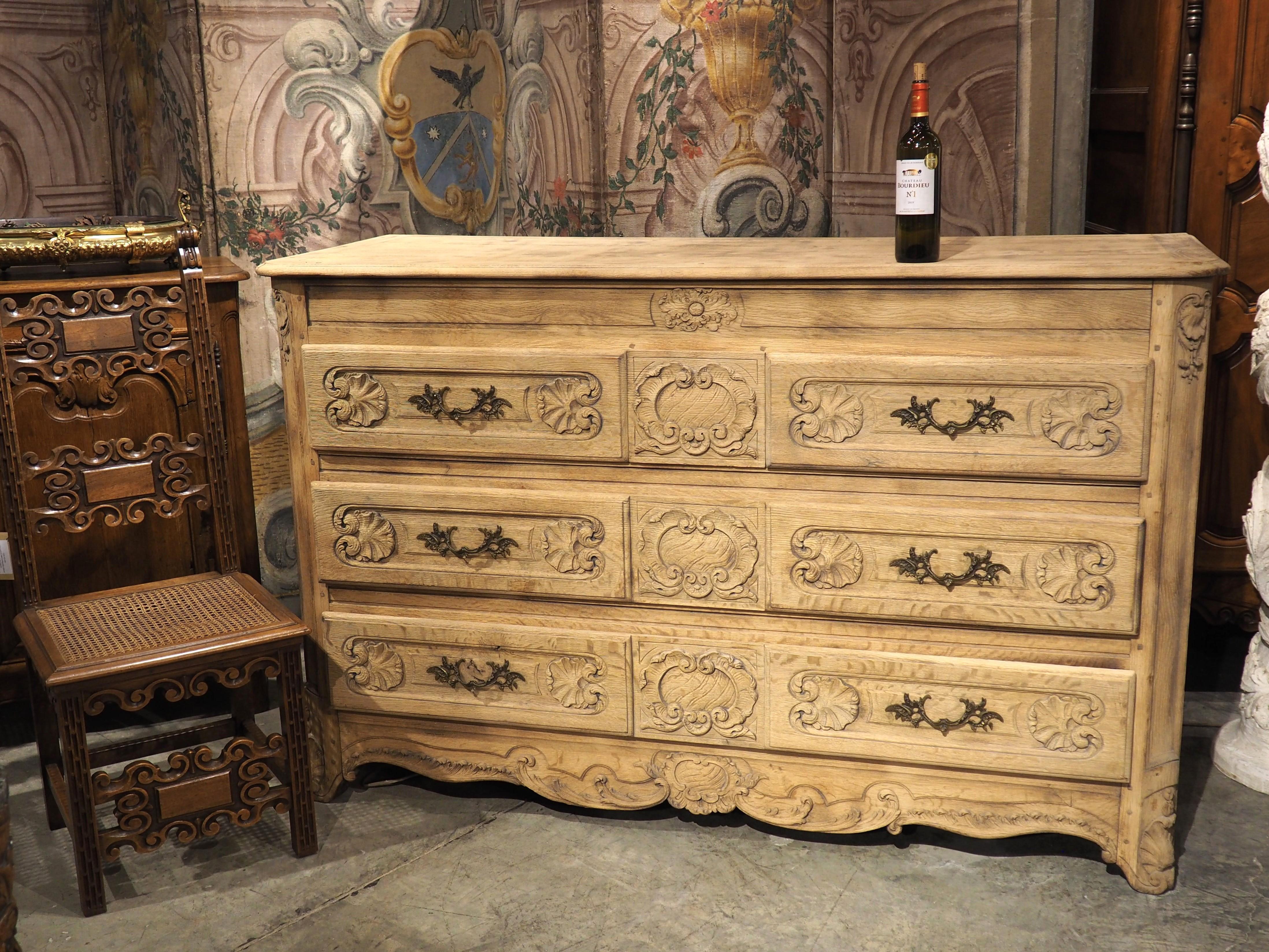 Bleached A Large 19th Century Carved Oak Commode from France For Sale