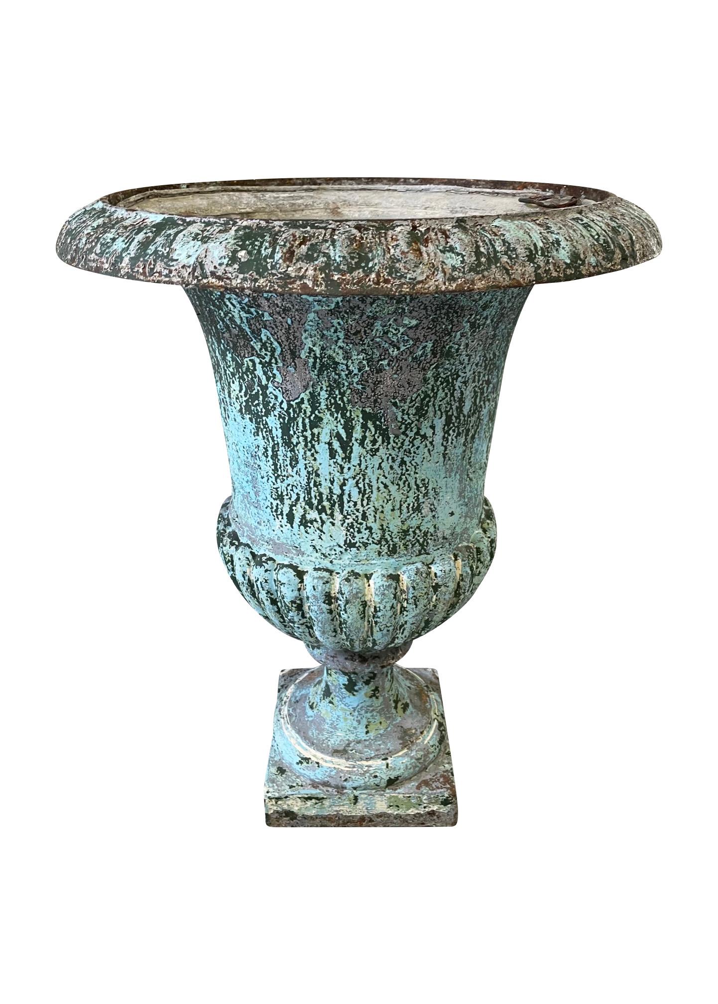 A 19th century French cast iron urn with fluted lower body and everted rim, this urn has great proportions, a fantastic aged look to the old layers of paint

A truly lovely urn with the original tin liner, with gorgeous time created patina this urn
