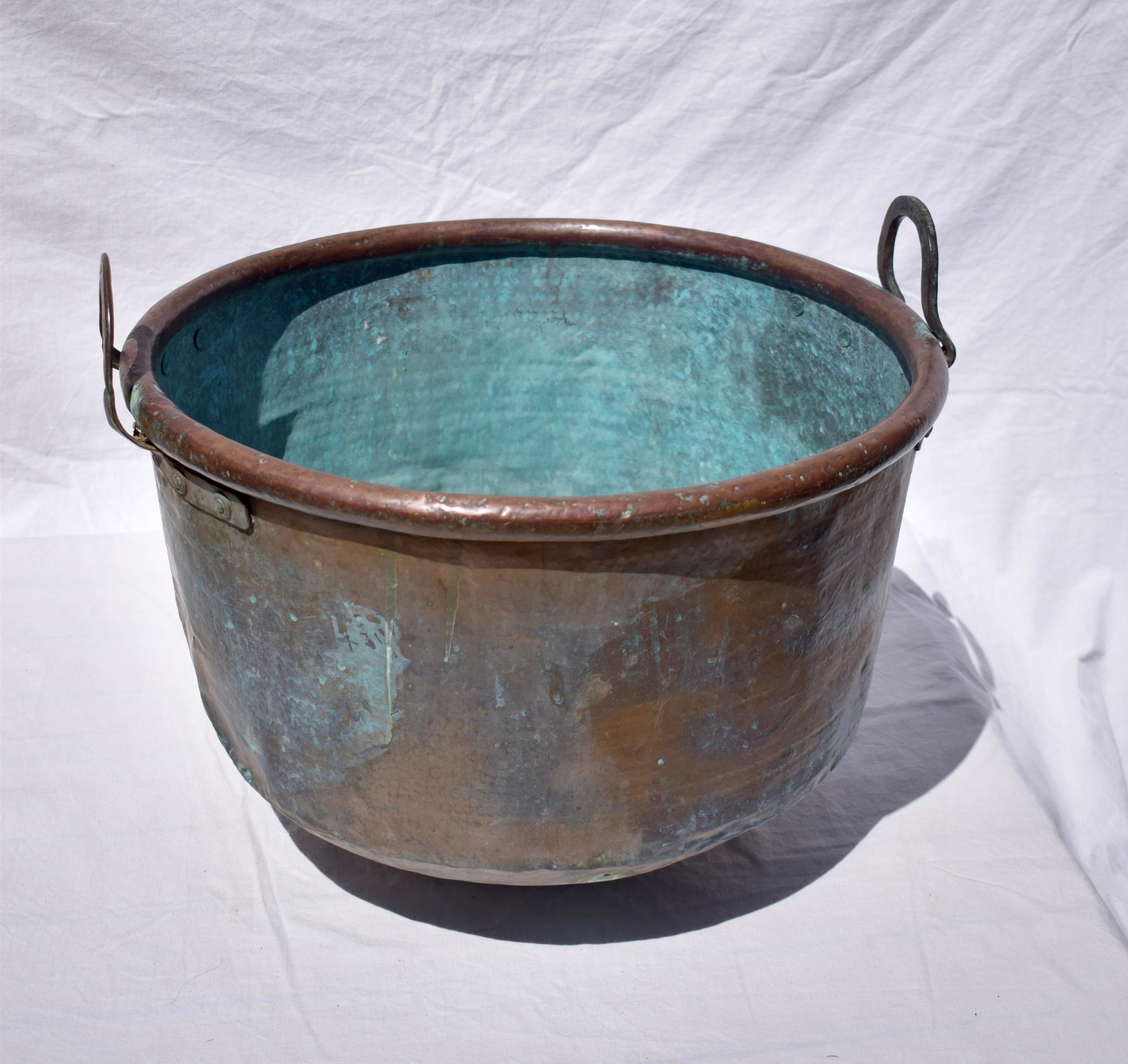 large antique copper cauldron