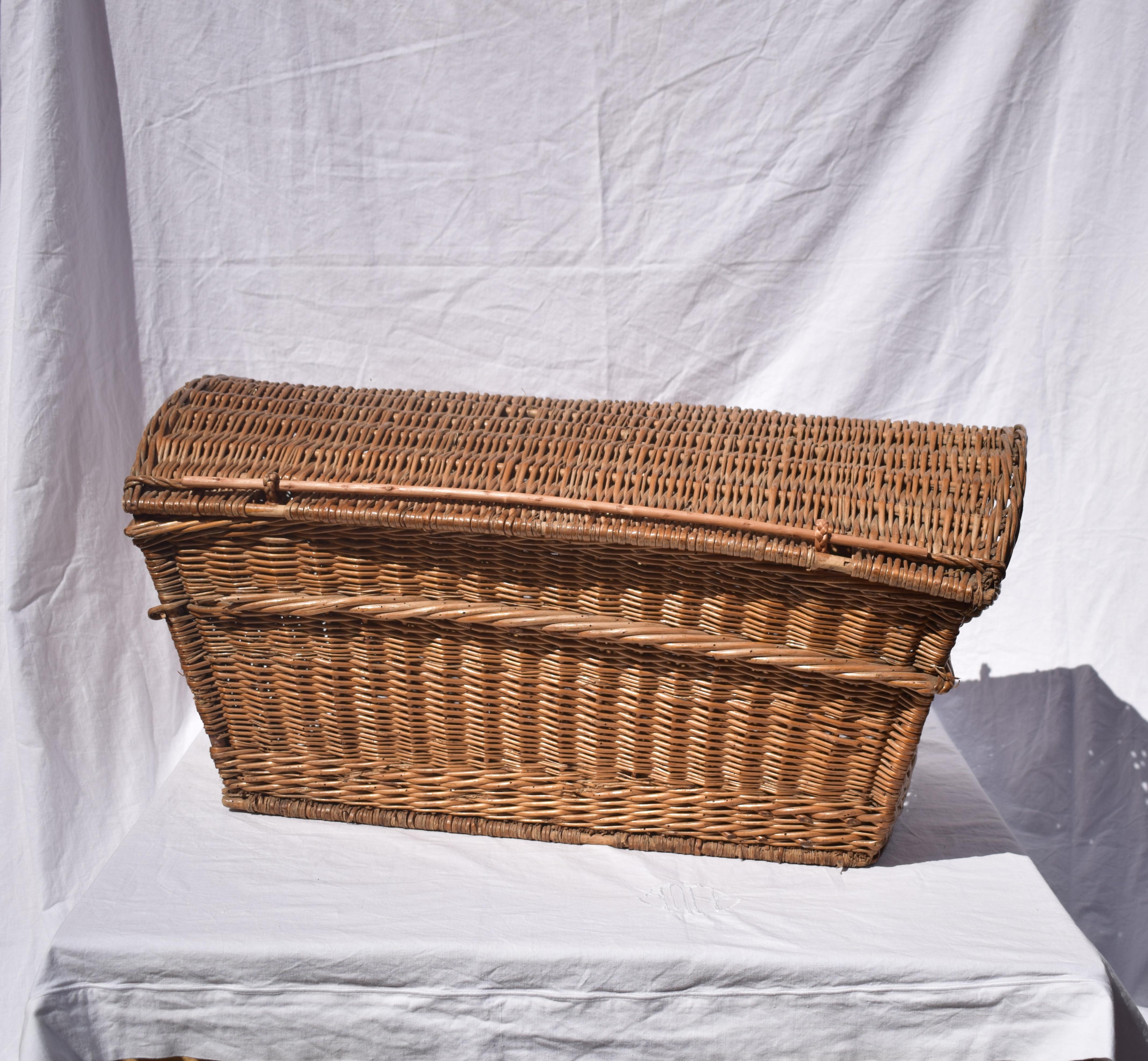 A large 19th century French wicker case with lid. Very sturdy. Woven in a thick wicker with original features. Some areas of the case have been restored and the wicker has been treated for woodworm.