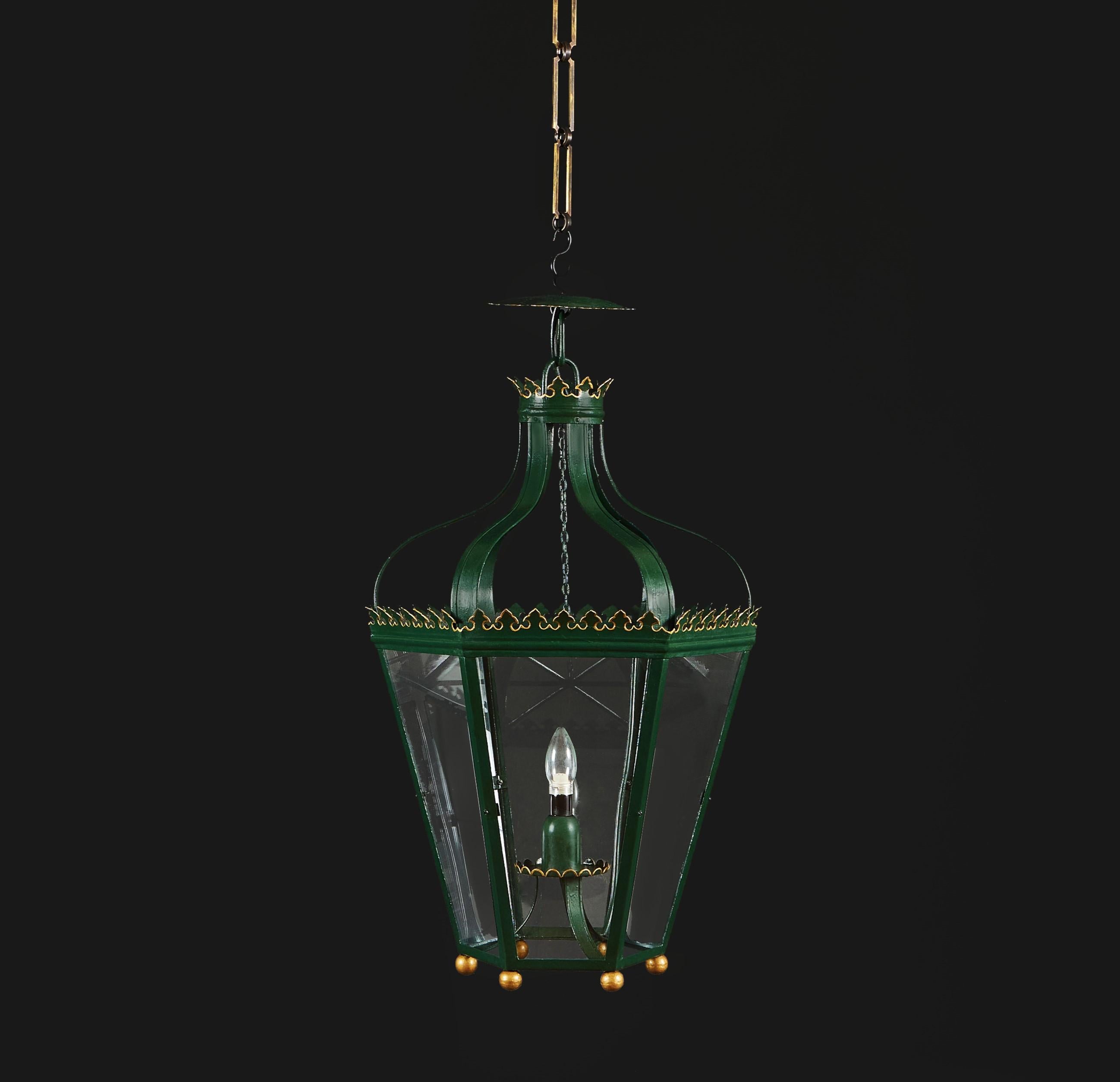 England, circa 1870

A late 19th Century neo-gothic hanging lantern, with green tolework and contrasting gilt details.

Height 68 cm.

Diameter 43 cm.

Chain available upon request. Please see image of available options and contact us for