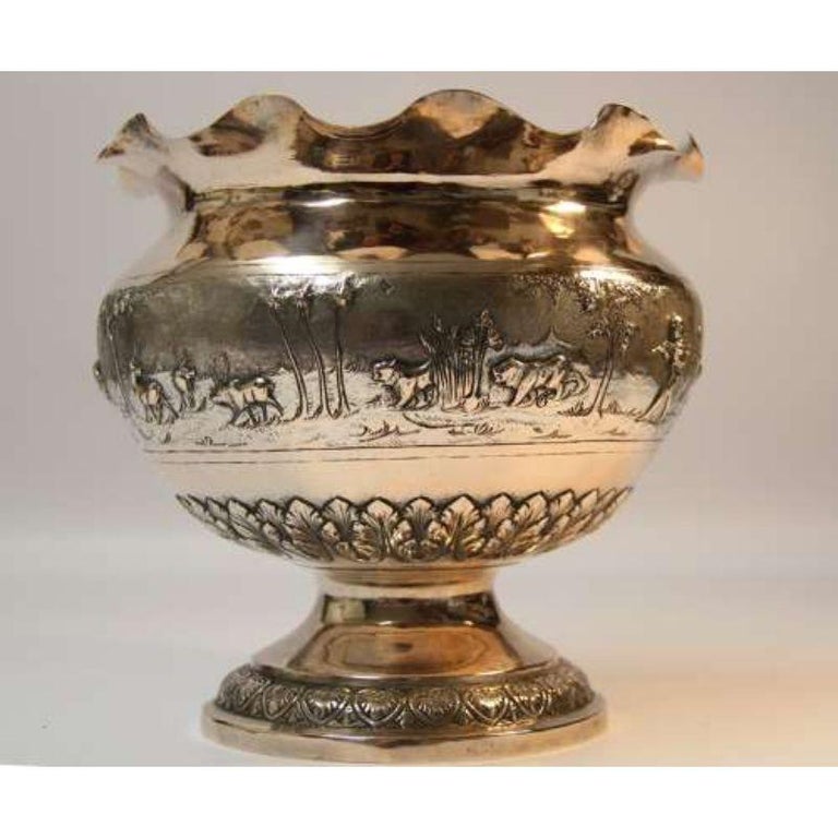 A Large 19th century Indian white metal bowl depicting big game hunting