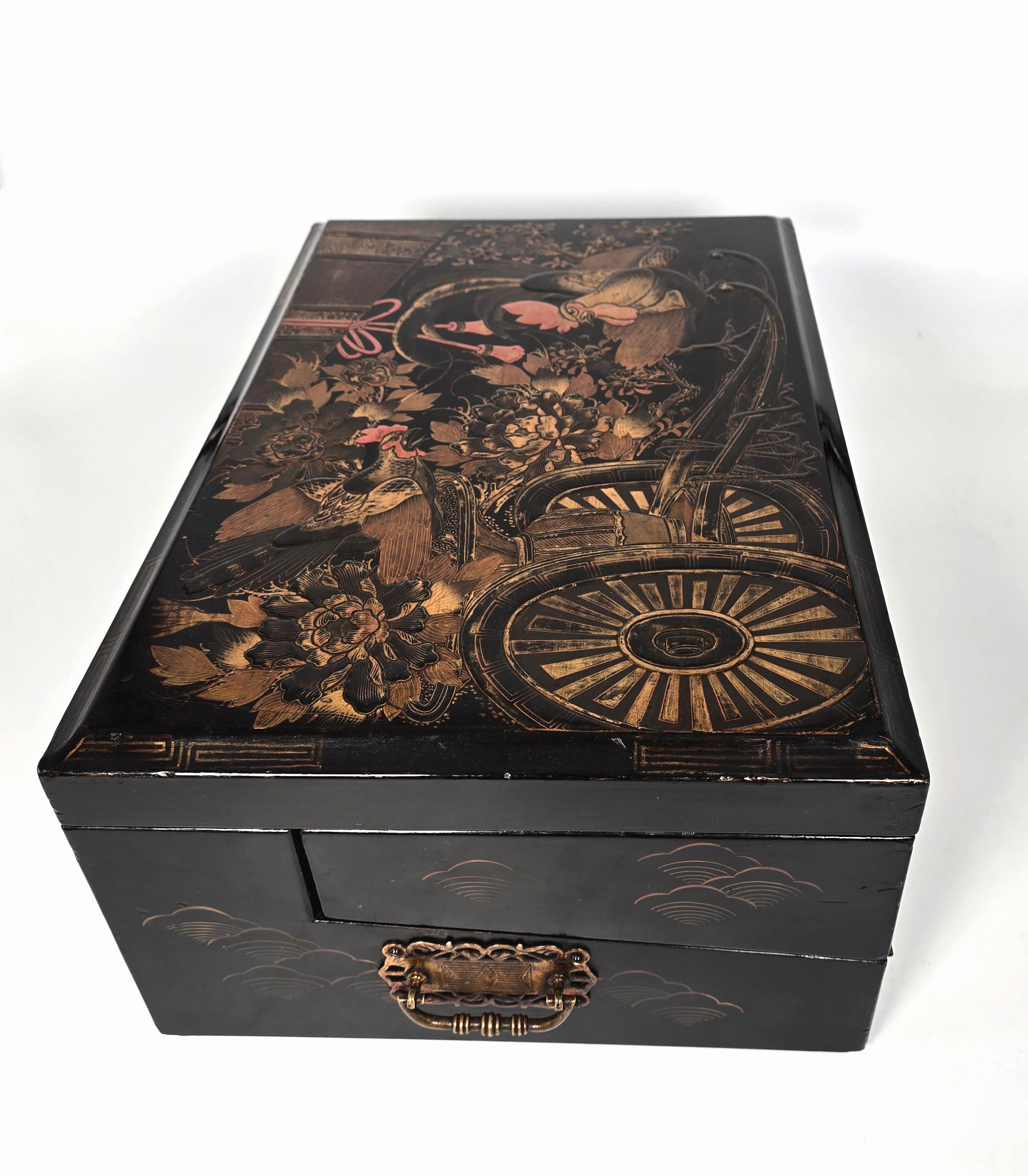 This remarkable and highly decorative Japanese export large writing box is a rare high quality example with a complicated and intricate interior.

The box is in very good condition considering this type of raised gilt lacquer has most often suffered
