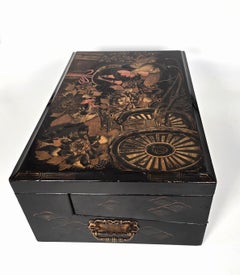 A large 19th century Japanese lacquer writing box with a secret compartment