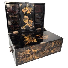 Antique A large 19th century Japanese lacquer writing box with a secret compartment