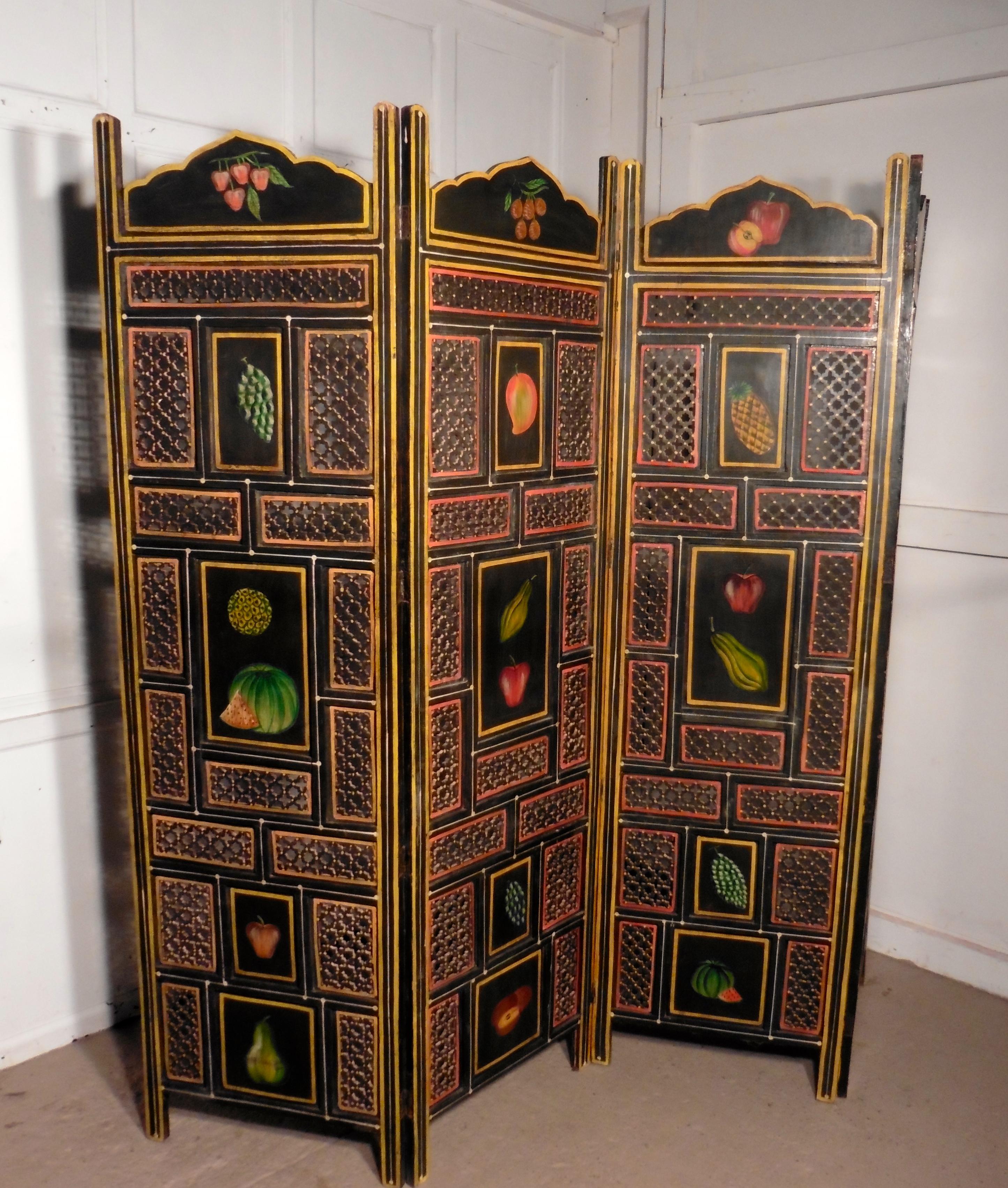 A large 19th century North African Folk Art pierced, painted 4-fold screen

This is a very heavy piece it has been handmade in hard wood and painted in traditional colours, the paint now has developed a genuine shabby but still colorful