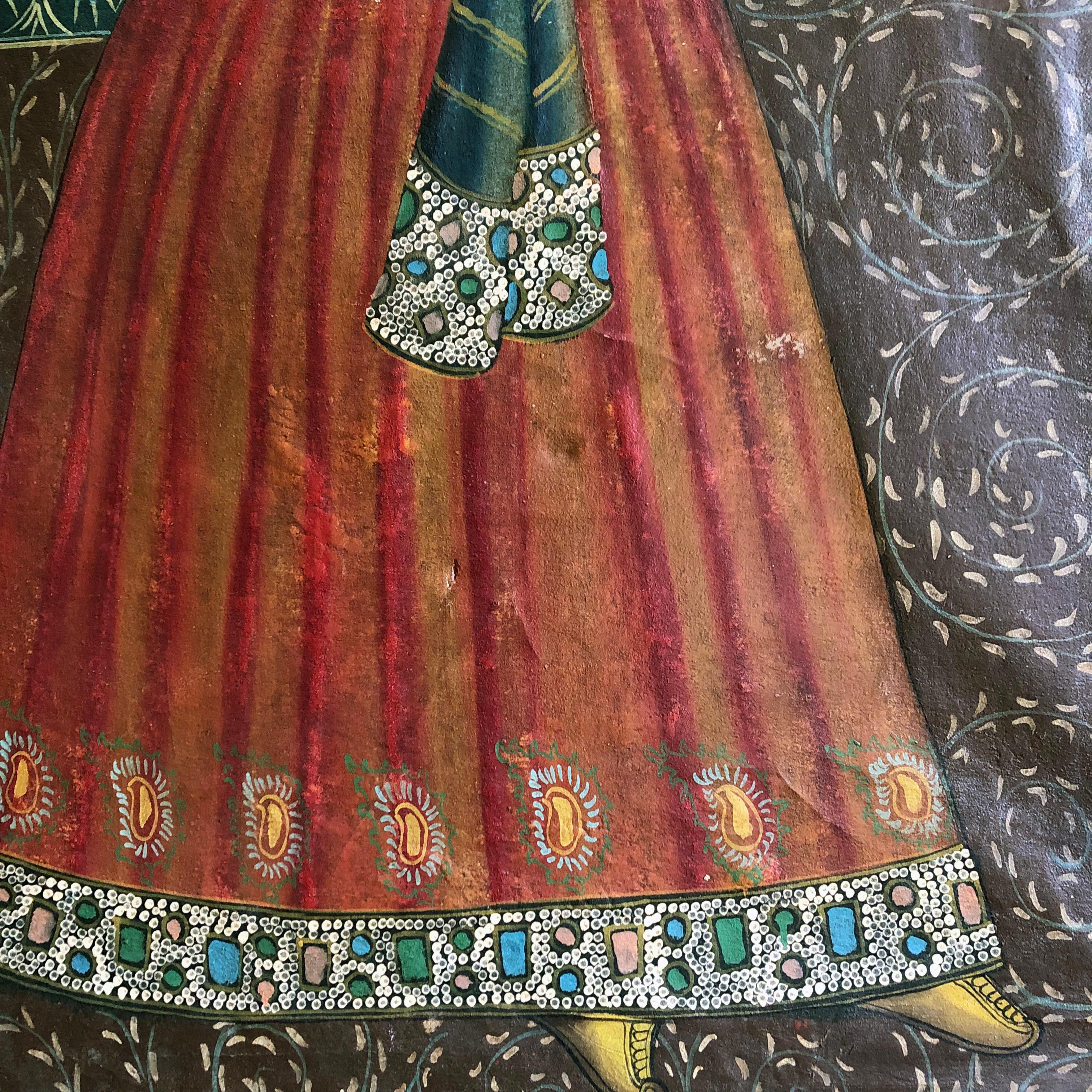 A wonderful large late C19th Qajar portrait of a dancer wearing flamboyantly embroidered and bejewelled costumes within a highly decorative interior.   Depicted full length, signed.  Age related minor bumps and scrapes.  A highly decorative and
