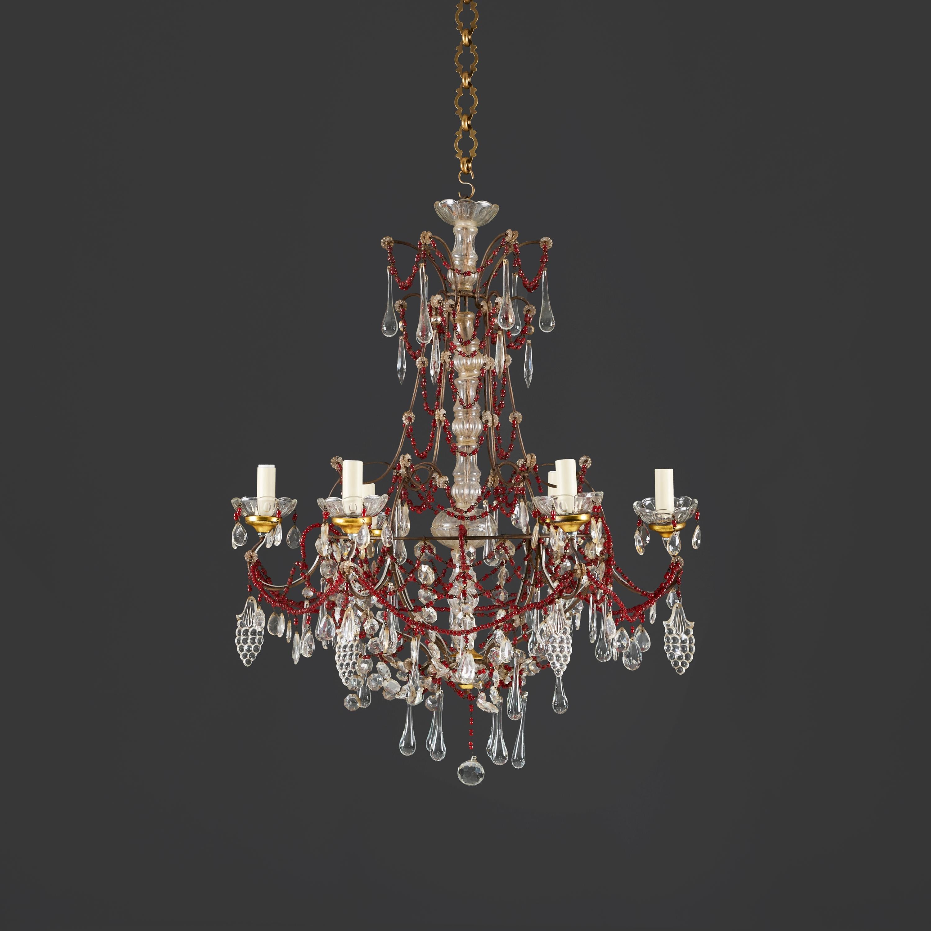 France, circa 1880

A late nineteenth century six arm chandelier in the manner of Maison Baguès, with garlands of red glass beads, hanging tear droplets and pressed grape motifs. The central stem decorated with cut glass segments and each arm