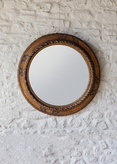 A large 19th Century round painted mirror