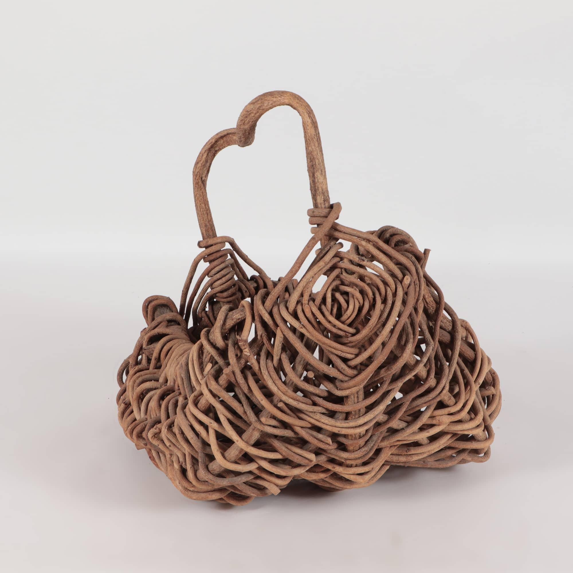 A large and beautifully executed 19th century vintage folk art tree twig branch basket sculpture.