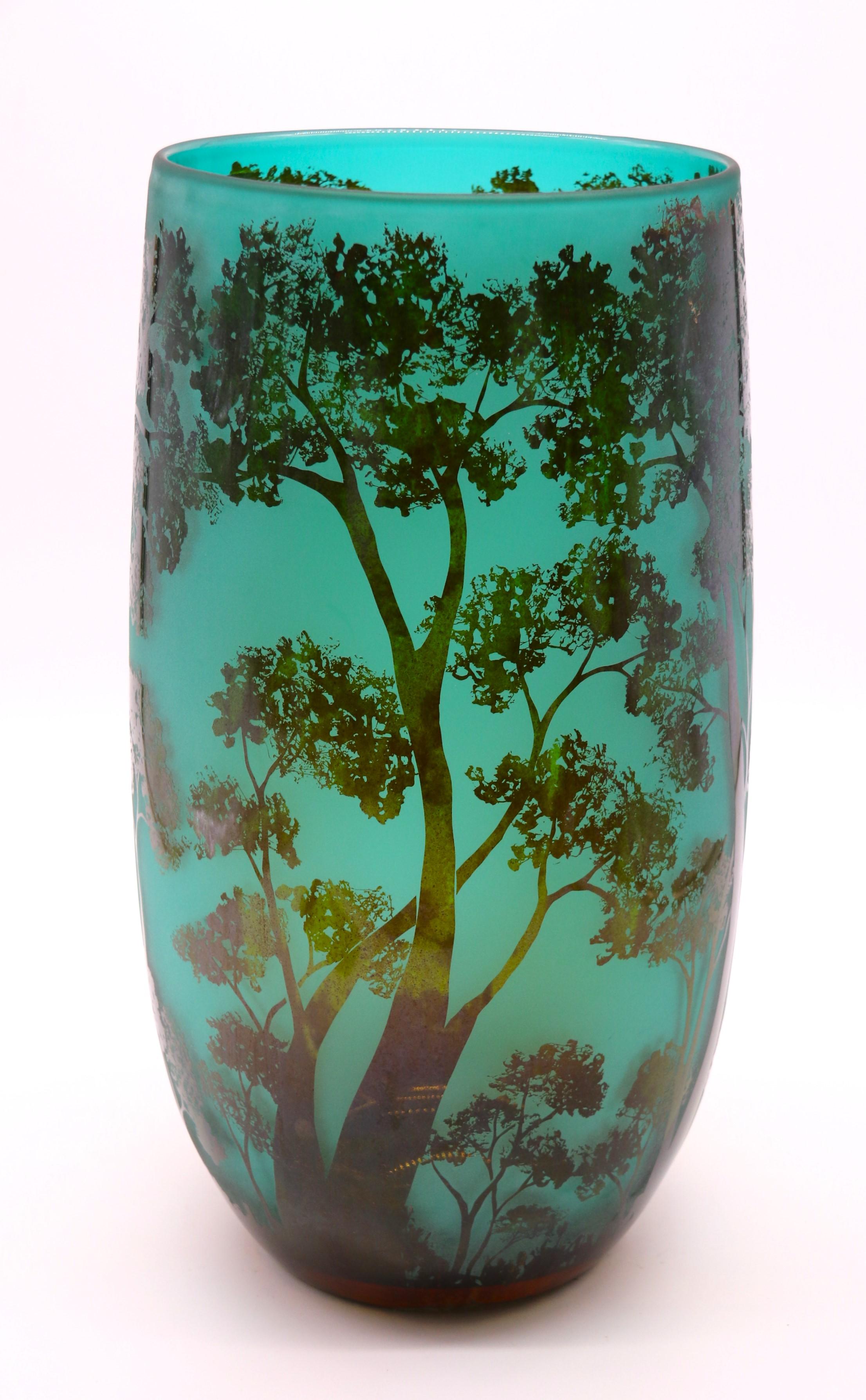 This most strikingly beautiful glass vase is a very large example which would have taken great skill to produce. It is made in two layers of glass. The inner, a most unusual shade of soft blue/turquoise glass overlaid with a mottled rich bronze