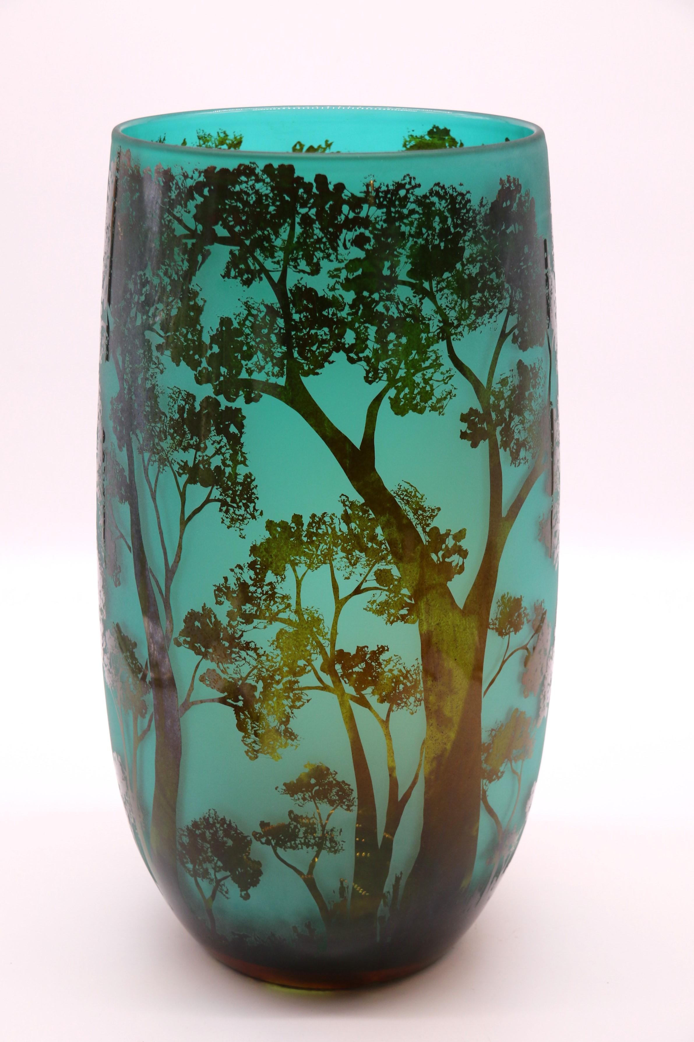 Etched A large 20th century cameo glass vase decorated with an intricate woodland scene