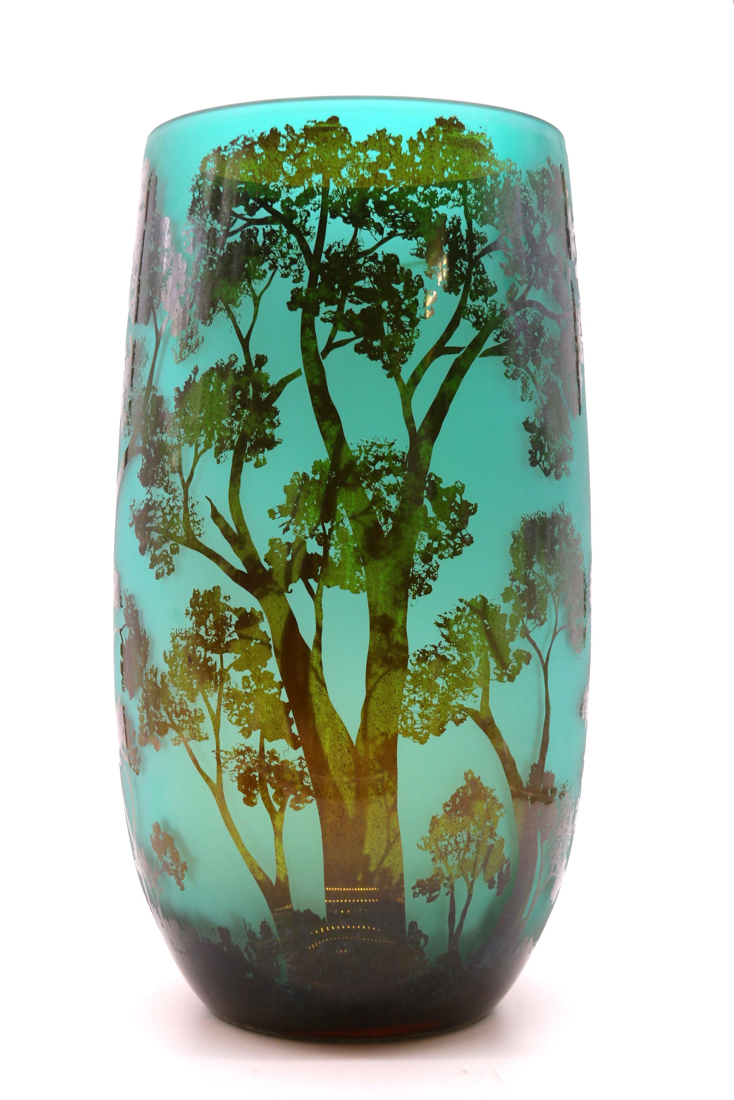 Glass A large 20th century cameo glass vase decorated with an intricate woodland scene
