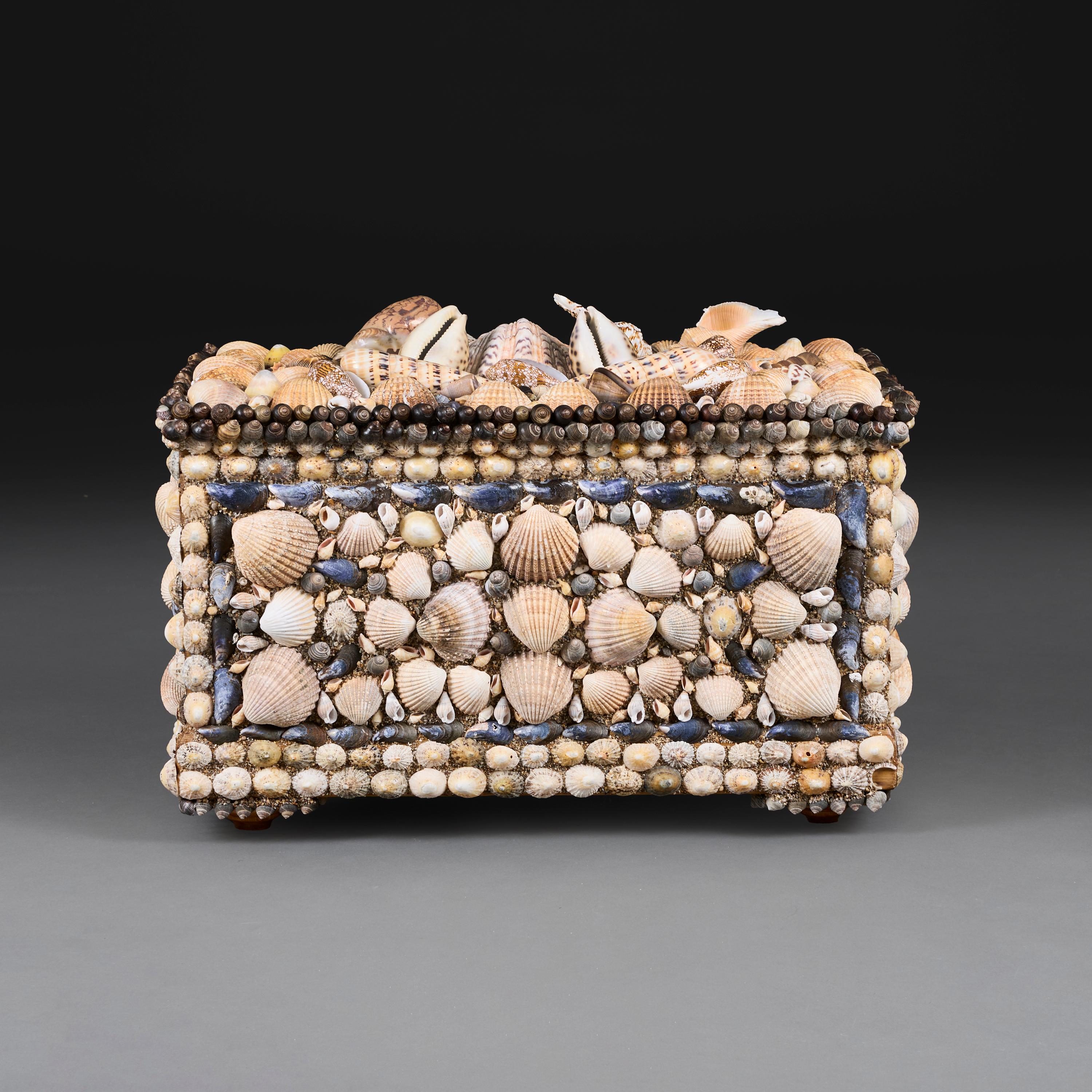 England, circa 1950

A large mid-20th Century folk art shell encrusted chest, to include native and Indo-Pacific shells arranged profusely in a geometric display.  

Height 45.00cm

Width 64.00cm

Depth 40.00cm