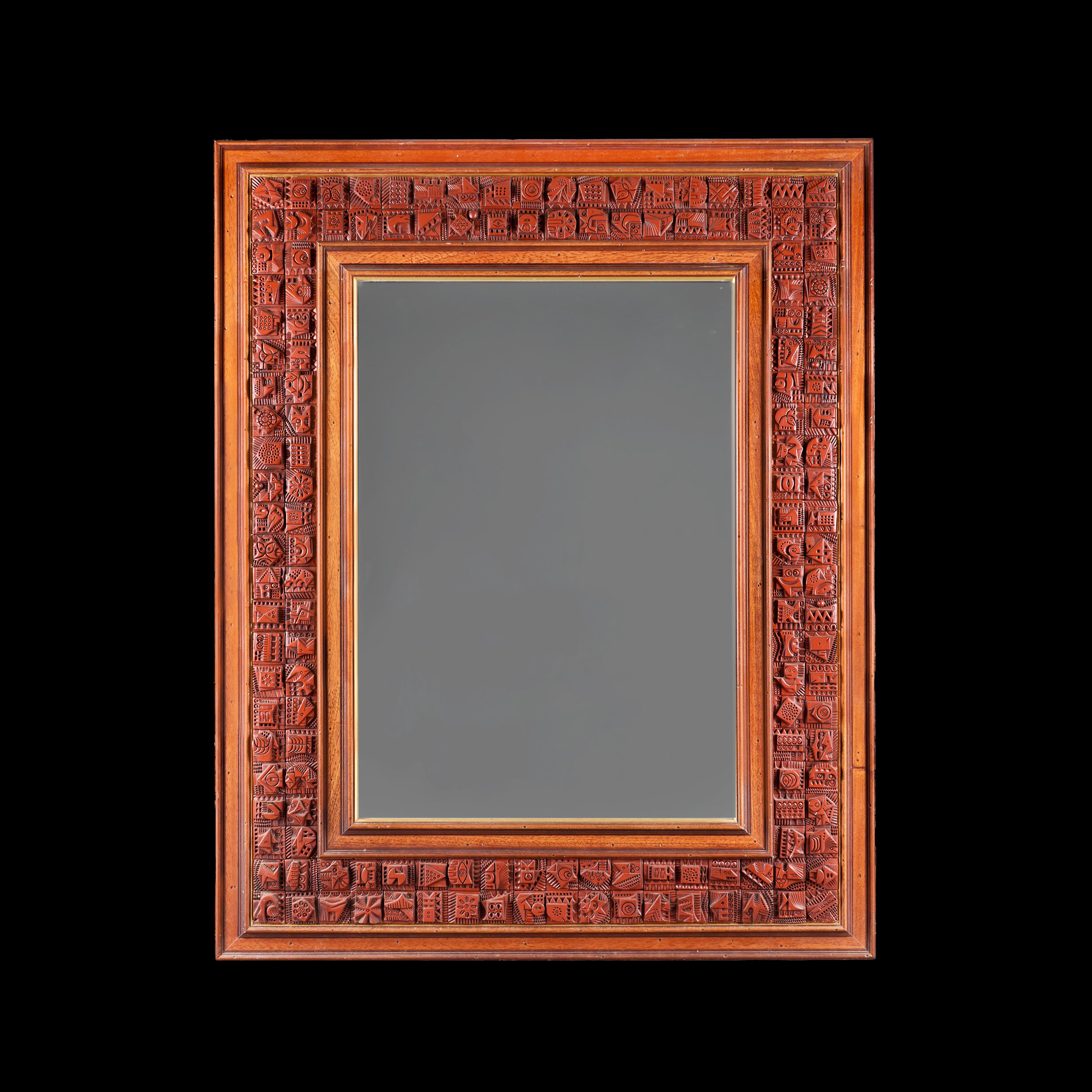 England, circa 1960

An unusual large rectangular mirror by artist Ron Hitchins, the wooded frame mounted with numerous hand carved terracotta tiles of abstract geometric design, signed to the lower corner.

Height 130.00cm

Width 104.00cm

Ron