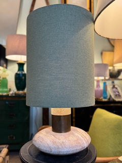 A large 70s elliptical Italian travertine and brass lamp by Fratelli Mannelli