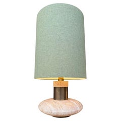 A large 70s elliptical Italian travertine and brass lamp by Fratelli Mannelli