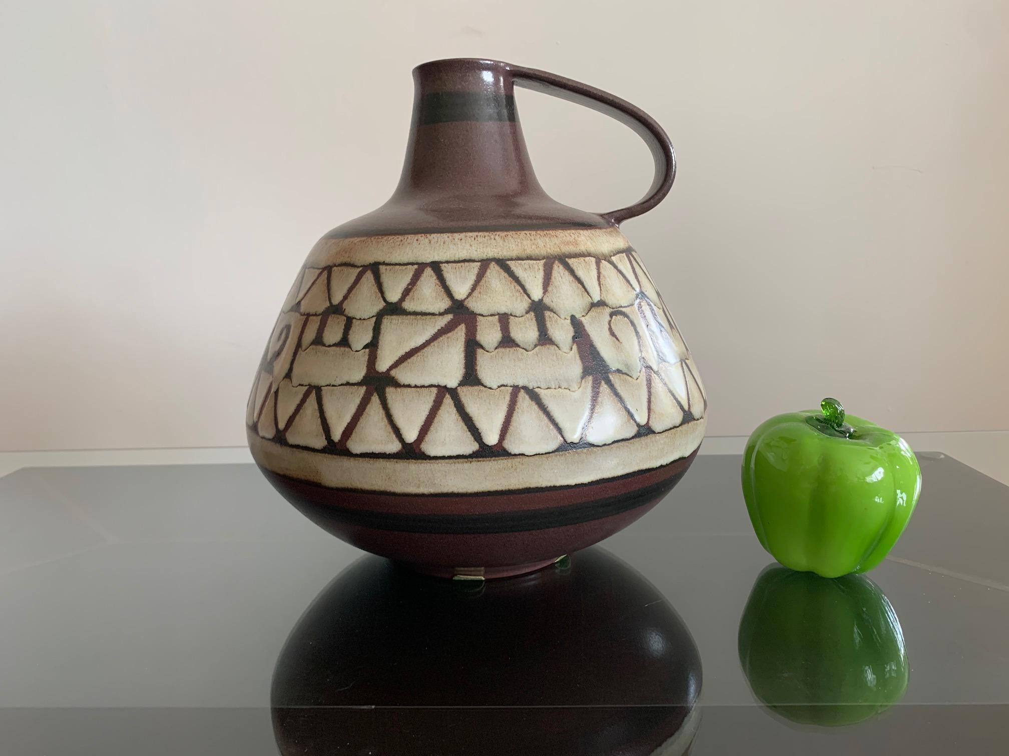 A large ceramic vessel by Alvino Bagni for Raymor, Italy circa 1960s. Jug form with beautiful stylized decoration in shades of brown.