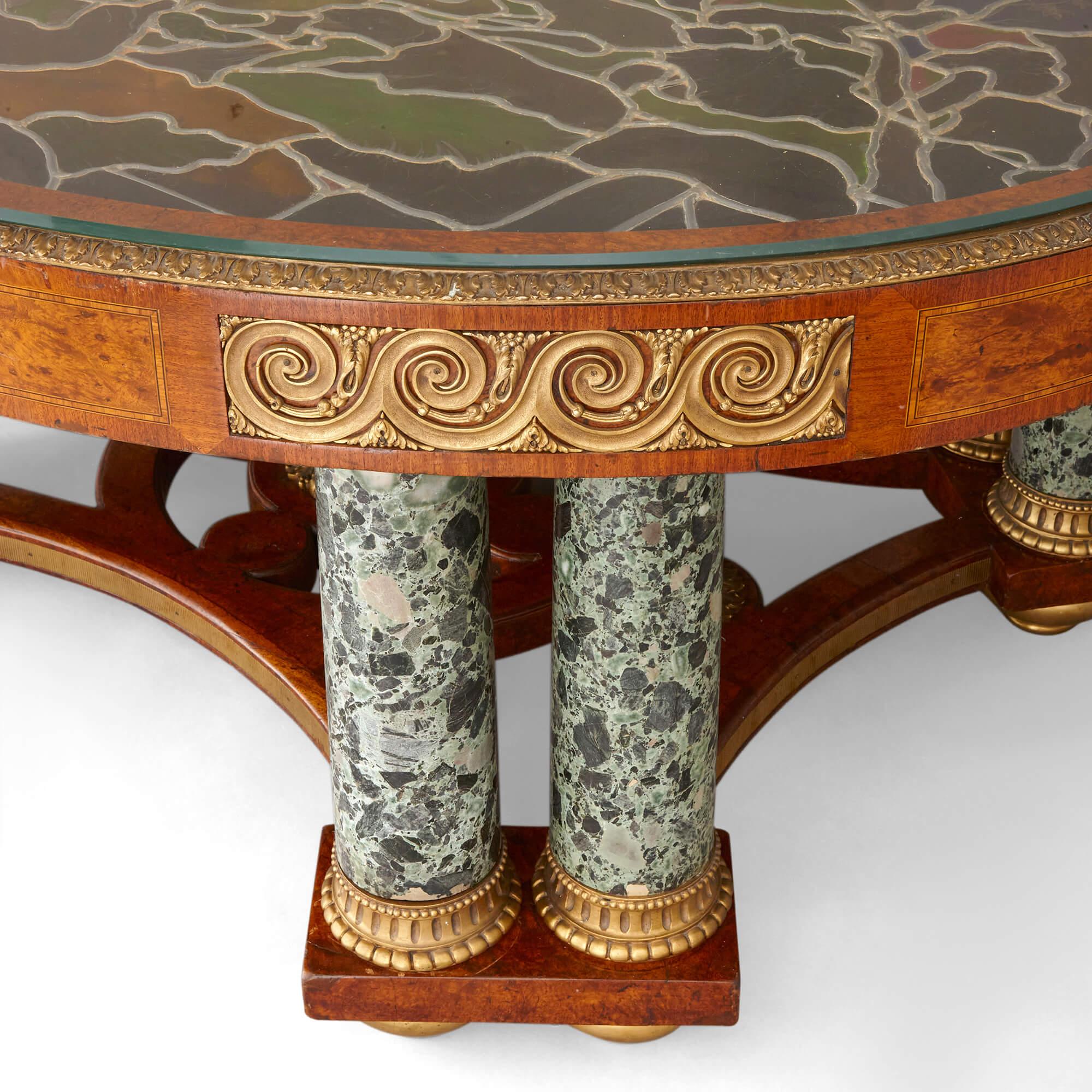 A large amboyna, stained glass, marble, and ormolu mounted centre table In Good Condition For Sale In London, GB