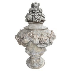 A Large and Decorative Italian Fruit and Floral Garden Urn in Composition Stone