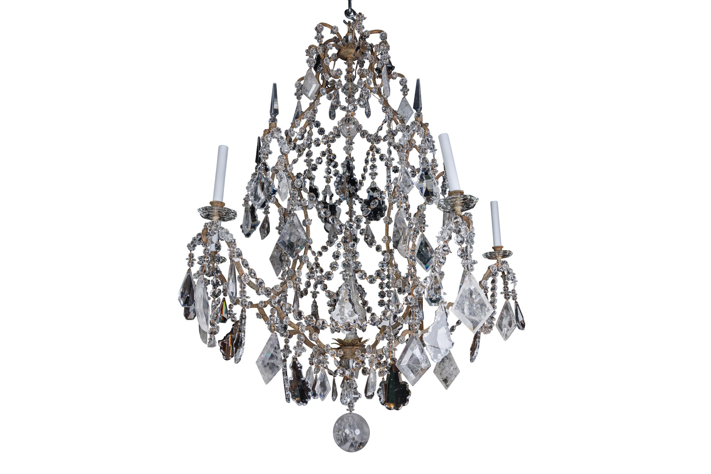 Elevate your space to unparalleled heights of sophistication with this Large and Exceptional Pair of French Rock Crystal, Glass, and Wrought Iron Five-Light Chandeliers. Meticulously crafted, these chandeliers epitomize the fusion of artistry and