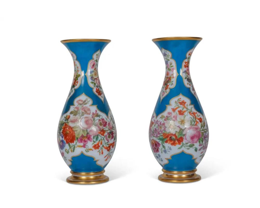A Large and Exquisite Pair of French Baccarat Opaline Glass Vases, 19th Century, Circa 1870
 
This stunning pair of vases, crafted by the renowned French glassmaker Baccarat, exemplifies the opulence and artistry of 19th-century French design. The