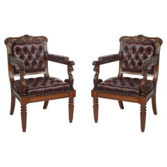 A large and fine pair of rosewood Regency armchairs